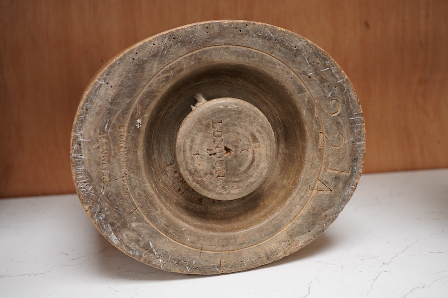 A 19th century milliners hat block stamped Stow & Huggins Ltd, London, 18cm